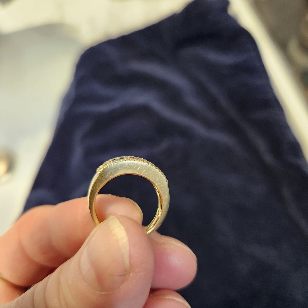 Le Vain multi- colored stones set in thick gold.  It's lovely, I hate to part it